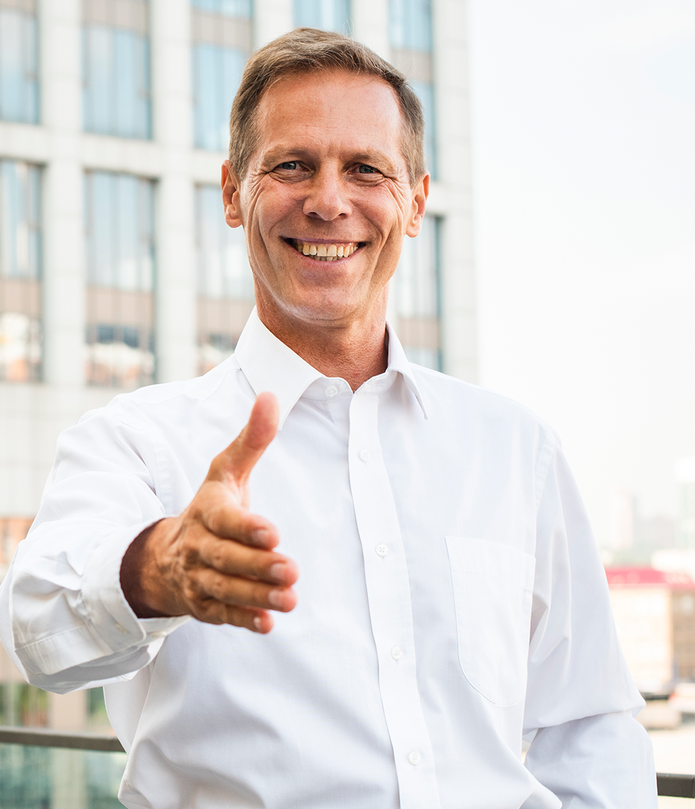 serious-businessman-extending-hand-handshake_1262-2415